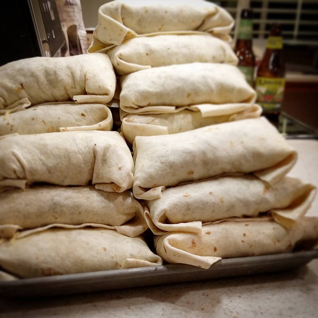 Stack of wrapped burritos